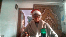 a man wearing a santa hat and a robe is holding a microphone in front of a radio button