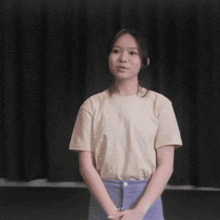 a young girl wearing a t-shirt that says i on it