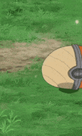 a pokemon ball is glowing in the grass with smoke coming out of it