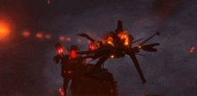a dragon is flying through the air in front of a large fire