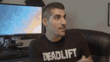 a man wearing a shirt that says deadlift