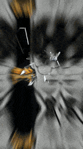 a black and yellow background with a few pieces of glass flying in the air