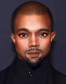a close up of a man 's face with makeup on