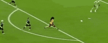 a group of soccer players are playing a game on a field