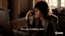 a woman talking on a cell phone with the words " are you kidding me " on the bottom