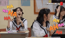 a group of girls in school uniforms are laughing in a classroom with a free fire logo on the bottom