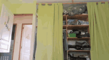 a closet with green curtains and a sign that says ' i love you ' on the wall