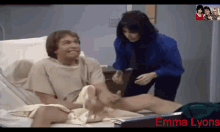 a man in a hospital bed with emma lyons written on the bottom right
