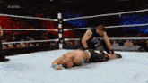 two men in a wrestling ring with the hashtag #ustitle on the bottom