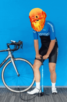 a man wearing a mantel shirt pumps a bicycle tire