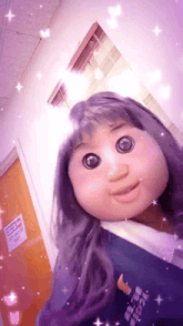 a doll with purple hair is wearing a blue shirt that says i love you