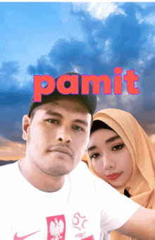 a man and a woman are posing for a picture with the word " panit " in red