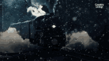 an advertisement for country living shows a train going through the snow