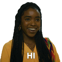 a woman with dreadlocks is smiling and says hi in white