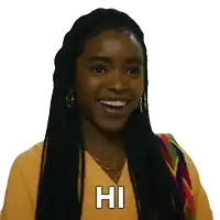 a woman with dreadlocks is smiling and says hi in white