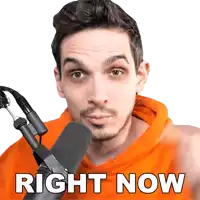 a man wearing an orange hoodie stands in front of a microphone with the words right now written below him