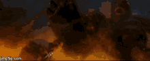 a monster is coming out of the ground in a movie scene with the website imgflip.com at the bottom .
