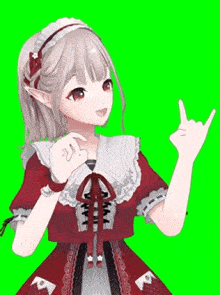 a girl in a red dress is making a peace sign