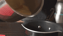 Pouring Two Plaid Aprons GIF - Pouring Two Plaid Aprons Transferring The Soup GIFs