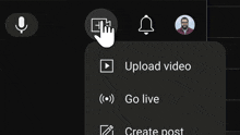 a hand is pointing at the upload video option