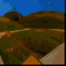 a blurry picture of a person walking down a street with houses in the background