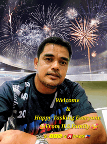 a man is sitting in front of a fireworks display with the words welcome and happy tasking everyone from ils family