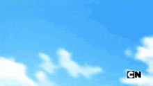a blue sky with white clouds and cn written on the bottom