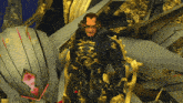 a man in a black and gold armor stands in front of a gray and gold object