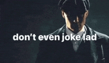 a man in a suit and hat with the words " don 't even joke lad "