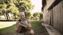 snake dean schneider holding a snake pet snake