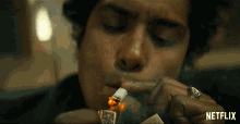 Smoking Lighting Cigarette GIF - Smoking Lighting Cigarette Cigarette GIFs