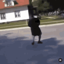 a man with a backpack is walking down the street .