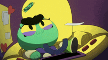 a cartoon character laying on a couch with a sticker on his head that says ' i love you '