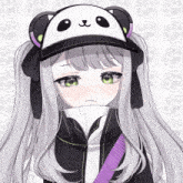 a girl wearing a panda hat with a purple strap