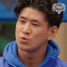 a man is wearing a blue jacket with a canada ultimate challenge logo on it