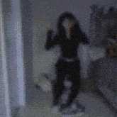 a blurred image of a person standing in front of a mirror