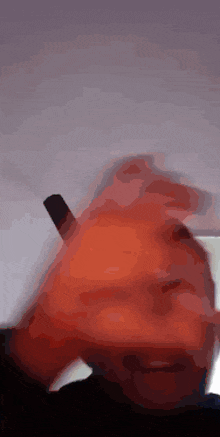 a close up of a person 's hand holding an electronic cigarette