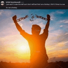 a silhouette of a man holding chains in his hands with a sunset in the background .