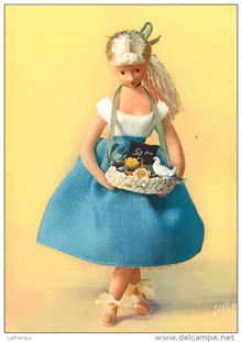a doll in a blue dress is holding a basket of flowers with a sign that says 50 en