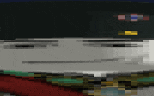a blurred image of a person 's face with a few flags visible