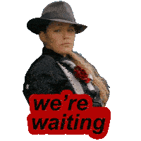 a woman wearing a hat and a suit has a sticker that says we 're waiting
