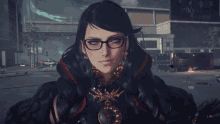 a close up of a woman wearing glasses and earrings with a building in the background that says db