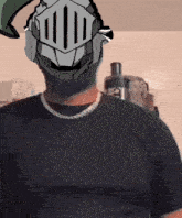 a man wearing a knight 's helmet and a black shirt