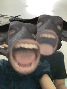 a person wearing a mask that looks like a cow with its mouth open