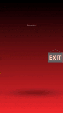 a sign that says exit hangs above a lion
