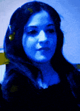 a woman 's face is shown in a pixelated image