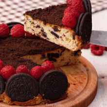 a slice of oreo cheesecake is being taken out of it