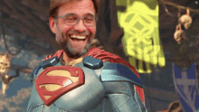 a man wearing a superman costume is smiling