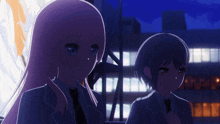 two anime girls standing next to each other in front of a building at night