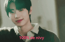 a close up of a person 's face with the words 100 % de nivy in red